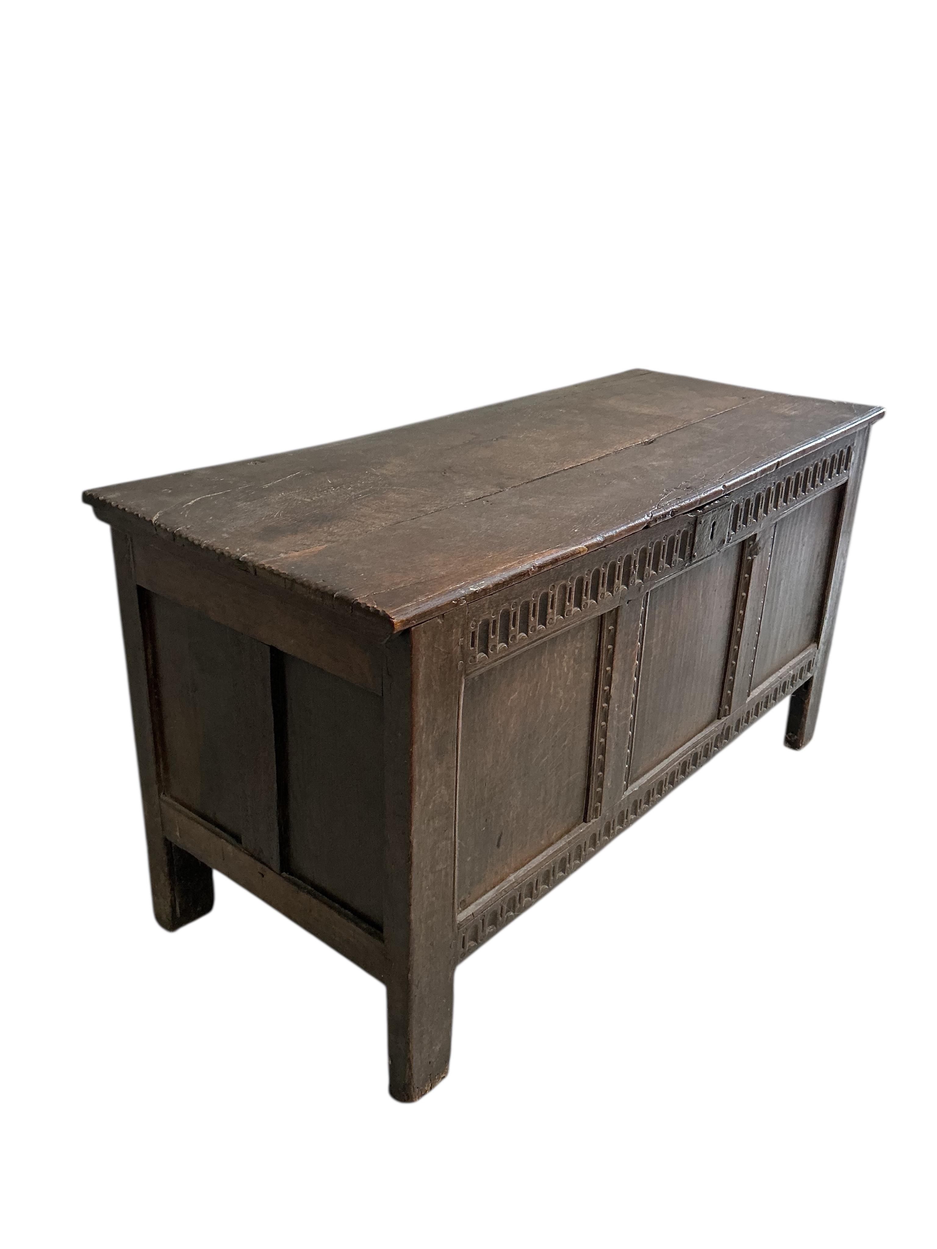 An 18th century oak coffer, width 122cm, depth 49cm, height 63cm